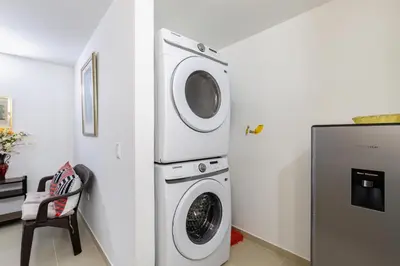 a laundry room with a washer and dryer at Full Apartamento Privado 202 Guatapé in Guatapé