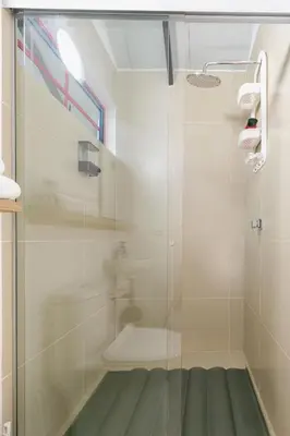 a shower with a glass door in a bathroom at Full Apartamento Privado 202 Guatapé in Guatapé