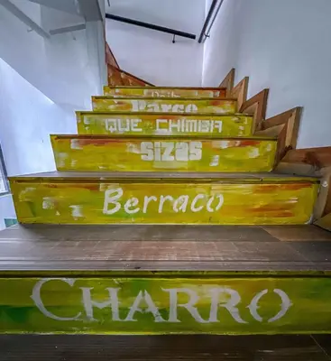 a group of stairs with signs on them at Hotel Medellin Arte in Medellín