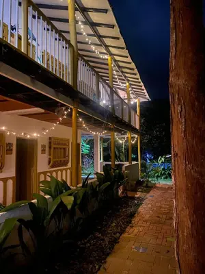 a patio with lights on a building at night at Casa Clandestina Campestre in San Rafael