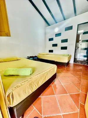 a bedroom with two beds in a room at Casa Clandestina Campestre in San Rafael