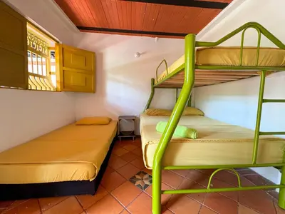 a small room with two bunk beds in it at Casa Clandestina Campestre in San Rafael
