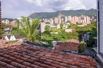 a view of a city from the roof of a building at Apartamento Lleras AC Hot Tub in Medellín