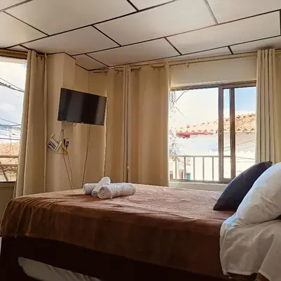 a bedroom with a bed with a towel on it at Apartaestudio central con balcón y wifi en Riosucio in Ruiosucio