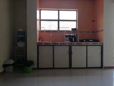 a kitchen with a counter with a window and a sink at Apartaestudio central con balcón y wifi en Riosucio in Ruiosucio