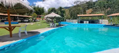 a large blue swimming pool in a resort at Cabaña vacacinal in Cocorná