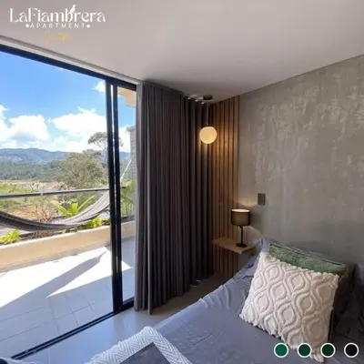 a bedroom with a bed and a large window at Nuevo apto con acceso al embalse en Guatapé in Guatapé
