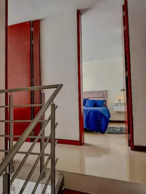 a room with a staircase and a bed in it at Apartamento Duplex en ubicacion privilegiada in Manizales