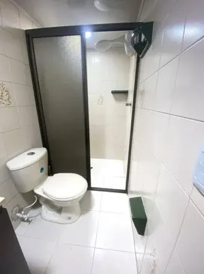 a bathroom with a toilet and a shower stall at Acogedora casa en Bello Antioquia in Bello