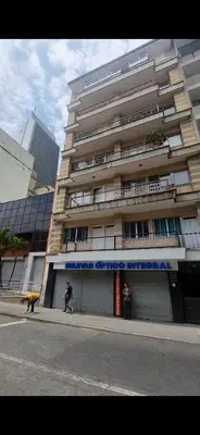 a large building with people walking in front of it at Casa grande en el centro de la cuidad in Medellín