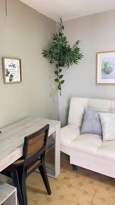 a living room with a table and a couch at REST APARTMENT IN THE POBLADO in Medellín