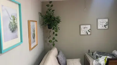 a living room with a plant on the wall at REST APARTMENT IN THE POBLADO in Medellín