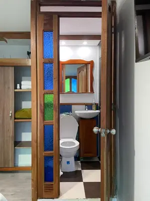 a bathroom with a toilet and a sink at Habitación La Amelia in Jericó