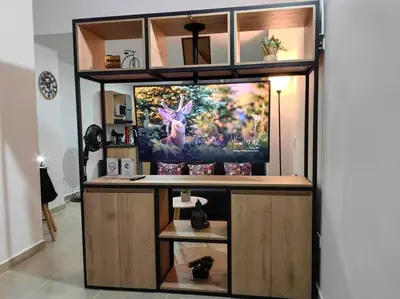 a room with a large tv on a wall at Apartaestudio completo en Itagüí - Shalom - 501 in Itagüí