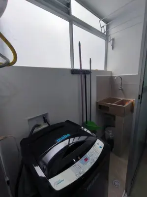a bathroom with a tv in a room with a sink at Apartaestudio completo en Itagüí - Shalom - 501 in Itagüí