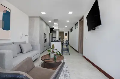a living room with a couch and a tv at Medellin-Cerca al Poblado-201 in Medellín