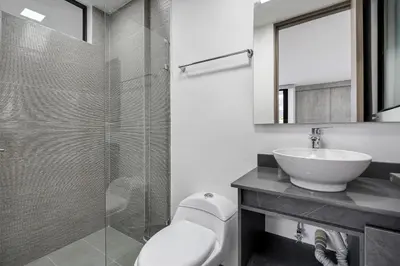 a bathroom with a toilet and a sink and a shower at Medellin-Cerca al Poblado-201 in Medellín
