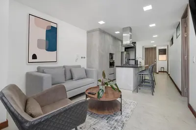 a living room with a couch and a table at MEDELLIN- Cerca al Poblado - 301 in Medellín
