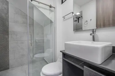 a bathroom with a sink and a toilet and a shower at MEDELLIN- Cerca al Poblado-401 in Medellín