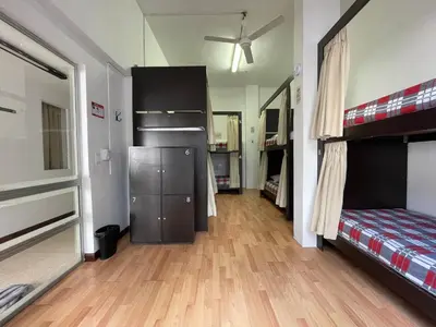 a bedroom with a bunk bed and a hard wood floor at Hostal Lleras Calle 8 in Medellín