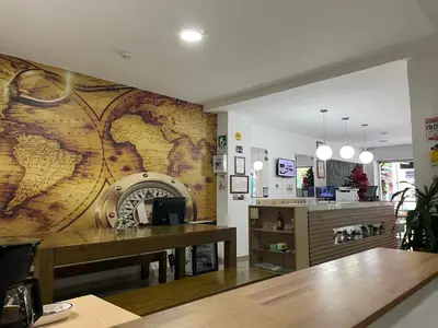 a restaurant with a large map on the wall at Hostal Lleras Calle 8 in Medellín