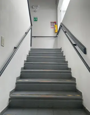a staircase in a building with a stair case at Hostal Lleras Calle 8 in Medellín