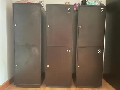 three metal lockers in a room with numbers on them at Hostal Lleras Calle 8 in Medellín