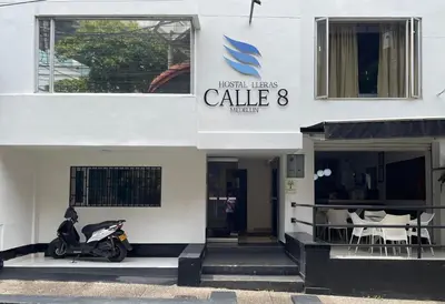 a scooter parked in front of a building at Hostal Lleras Calle 8 in Medellín