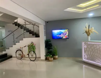 a bike parked in a room with a tv on the wall at Hotel Zona A in Medellín