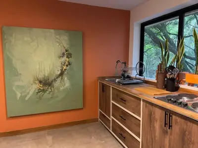 a kitchen with a sink and a large painting on the wall at Apto BBC With Jacuzzi In Heart Of Provenza in Medellín