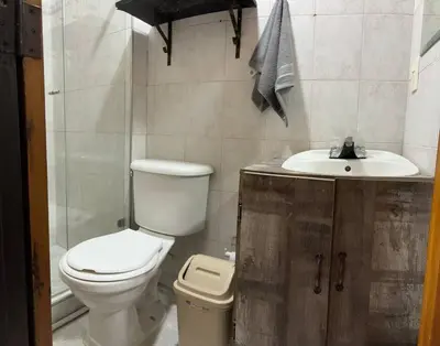 a bathroom with a toilet and a sink at Apartamento en Bello Medellín in Bello