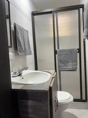 a bathroom with a sink and a toilet at Apartamento en Bello Medellín in Bello