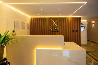 a room with a nord sign on a wall at Naiot Hotel Boutique in Medellín