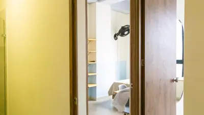 a door leading into a room with a hallway at Selva House in Medellín