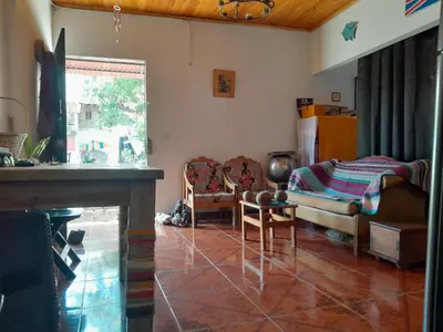 a living room with a couch and a table at Casa Rio y Montaña in Honda