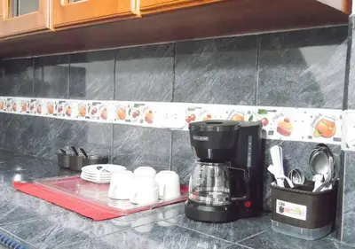 a coffee maker on a counter in a kitchen at Central y privado a 1km de la hacienda Nápoles in Doradal