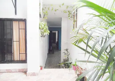 a hallway of a house with a door and plants at Central y privado a 1km de la hacienda Nápoles in Doradal