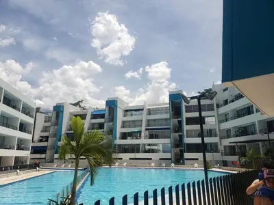 a swimming pool in front of a building at Apartamento el Paraíso T3-302 in San Jerónimo