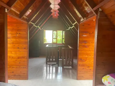 an open hallway in a wooden house with a window at La victoria in Marsella
