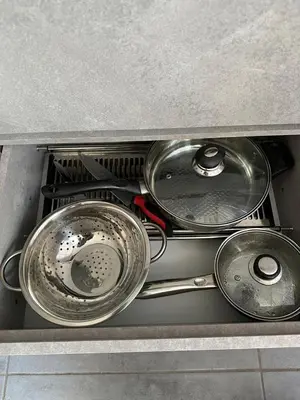a pile of pots and pans in a sink at Exclusive Studio in the Best Laureles Area in Medellín