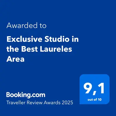 a blue sign with the text awarded to exclusive studio in the best landscapes area at Exclusive Studio in the Best Laureles Area in Medellín