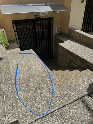 a blue cord is sitting on the ground in front of a door at Exclusive Studio in the Best Laureles Area in Medellín