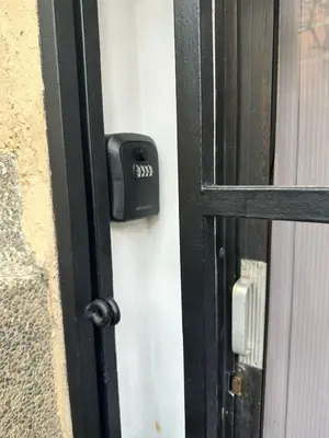 a black door handle on a door with a window at Exclusive Studio in the Best Laureles Area in Medellín