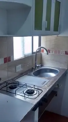 a kitchen counter with a sink and a stove at usoinmobiliario in Medellín
