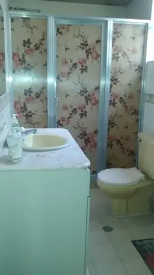 a bathroom with a sink and a toilet at usoinmobiliario in Medellín