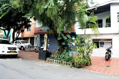 a motorcycle parked in front of a building at APARTAMENTO PRIVADO Y TRANQUILO EN MANILA. in Medellín