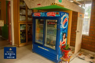 a blue video game machine in a room at Hotel El Portal de Salgar in Puerto Salgar