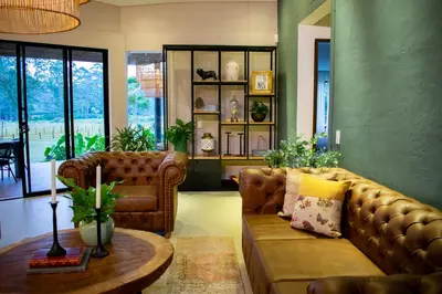 a living room with a couch and a table at Monarch Campestre- Rionegro in Rionegro