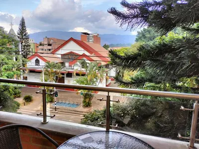 a balcony with a table and a view of a city at Exclusivo Apto lujoso central, sereno y cómodo 302 in Medellín