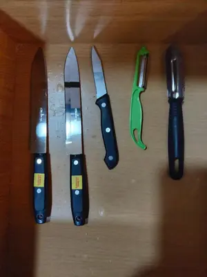 a group of knives sitting on top of a table at Exclusivo Apto lujoso central, sereno y cómodo 302 in Medellín